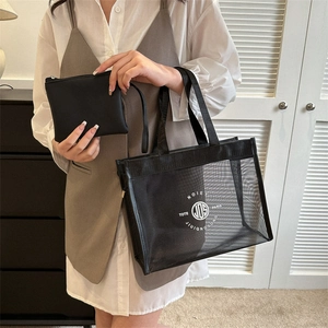 Large black mesh tote bag with retro white logo and matching inner pouch set