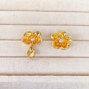 French vintage asymmetric gold flower earrings with hammered texture and cubic zirconia stones
