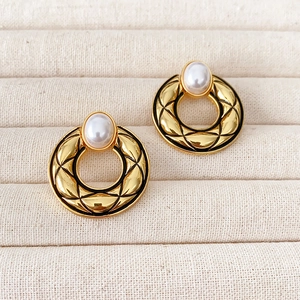 French vintage style round gold earrings with quilted pattern and white pearl drop