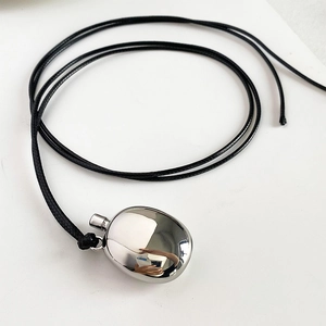 Modern silver oval perfume bottle pendant on black cord necklace for women