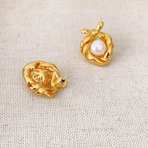 French style 18k gold plated bow earrings with freshwater pearls on textured fabric