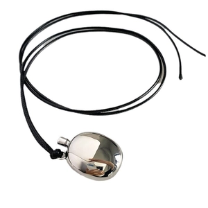 Minimalist black rope necklace with a polished silver-finish oval geometric pendant