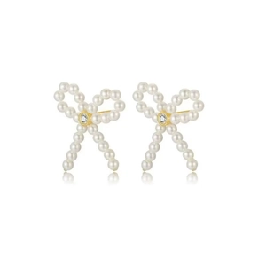 Elegant bow-shaped pearl earrings with gold base and zircon center on white background