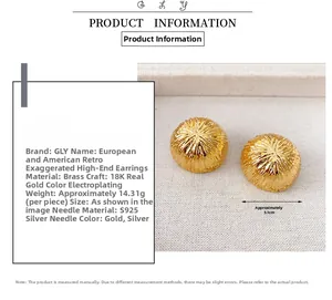 Detail of 31mm hollow gold dome earrings with tree bark texture and 18K plating