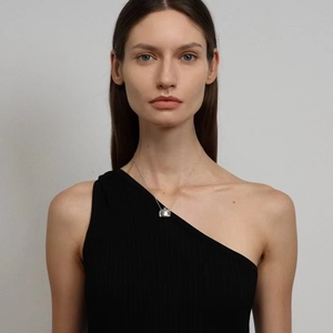 Minimalist silver chain necklace with a square perfume bottle pendant on model