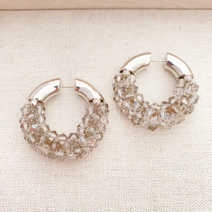 Handmade woven crystal hoop earrings with champagne beads and polished silver finish