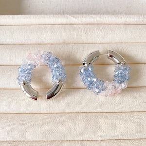 Chic beaded hoop earrings with blue and pink faceted crystals on polished silver hooks