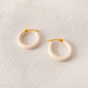 Minimalist thick hoop earrings with cream enamel finish and gold plated metal buckle
