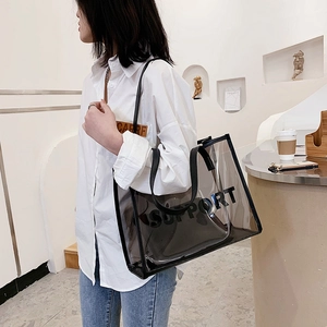 Transparent PVC tote bag with black Support lettering and leather shoulder straps