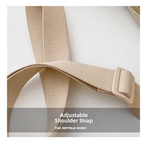 Detail of adjustable nylon shoulder strap with plastic buckle for versatile bag styling
