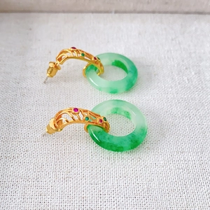 Vintage style emerald green jade earrings with gold hollow pattern and gemstone inlay
