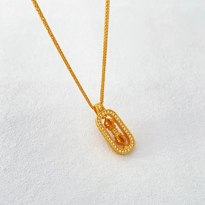 Collier rétro français doré avec pendentif Vajra rotatif orné de cristaux étincelants