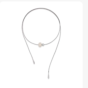 Minimalist long adjustable necklace with ivory white sphere and silver metallic droplets