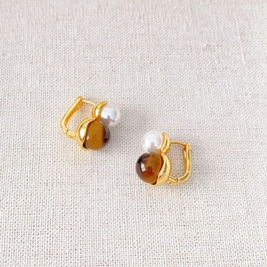 Gold-plated hoop earrings featuring natural pearls and brown tigers eye gemstones