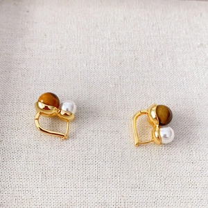 Minimalist gold-plated earrings featuring natural tiger eye stones and lustrous pearls