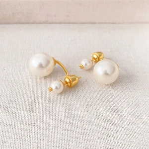 Elegant gold-tone double pearl stud earrings featuring a minimalist front-back drop design