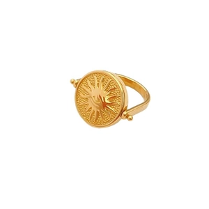Anello rotante dorato con rilievo del sole vintage su un disco celeste di lusso