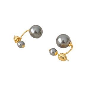 Elegant gold-tone stud earrings with gray pearls in a classic tribal double-bead design