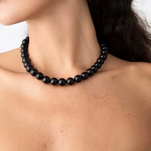 Minimalist black onyx beaded choker necklace with magnetic clasp on female model