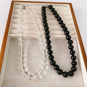 Beaded black onyx and clear crystal necklaces with magnetic spherical metal clasps