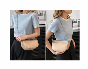 Beige crescent saddle bag with silver chain strap shown in shoulder and crossbody styles