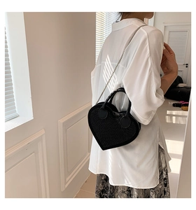 Fashionable black heart-shaped handbag with silver rhinestones and metal chain strap