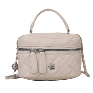 Chic quilted beige chain shoulder bag with silver floral hardware and dual zipper detail