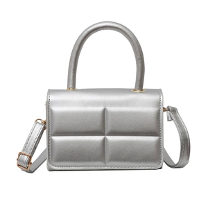 Quilted silver metallic mini square crossbody bag with top handle and golden hardware