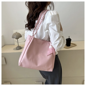 Pink houndstooth tote bag featuring woven rope straps and silk scarf detail