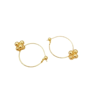 Polished gold plated hoop earrings featuring minimalist four-bead flower cluster accents