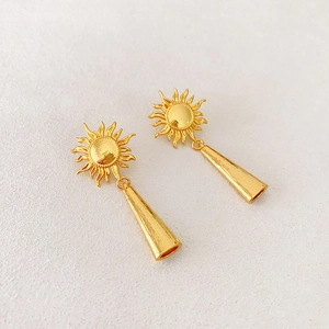 Detailed view of French vintage sunflower drop earrings with elegant gold fringe tassels