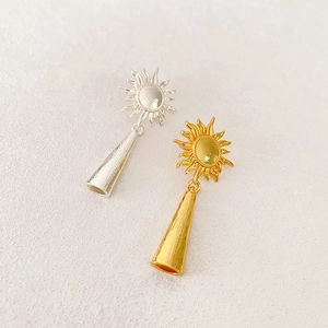 French vintage sunburst tassel earrings in gold and silver finish with sleek metal cones