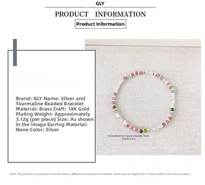 Detailed view showing silver beads and tourmaline bracelet specs on woven fabric