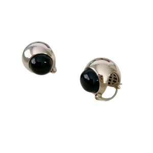 Minimalist silver hemisphere earrings with black onyx gemstone and polished metal finish
