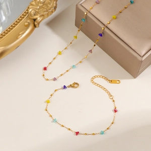 Set gioielli in acciaio al titanio dorato con pietre colorate, collana e bracciale
