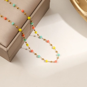 Handmade gold chain necklace with colorful crystal beads and minimalist design
