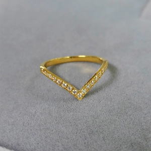 Minimalist V-shaped gold titanium ring with micro-paved cubic zirconia accents