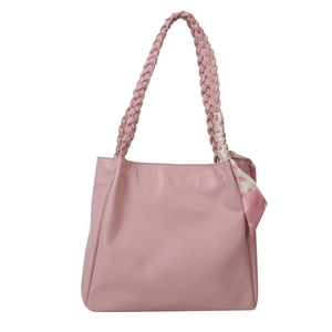 Pink PU leather tote bag with woven handles and silk scarf detail on white background
