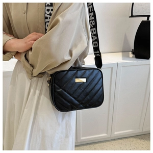 Fashionable black quilted crossbody bag with golden hardware and jacquard wide strap