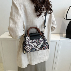 Ethnic geometric woven handbag with wooden handle and leather flap for women