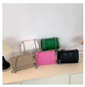 Group of small chain square bags in five colors with geometric quilted patterns