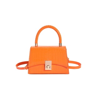 Orange faux crocodile leather handbag with woven handle and gold clasp for women