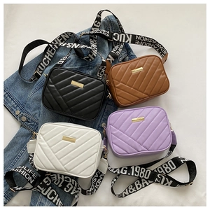 Close-up of quilted PU crossbody bags in four colors with stylish patterned straps