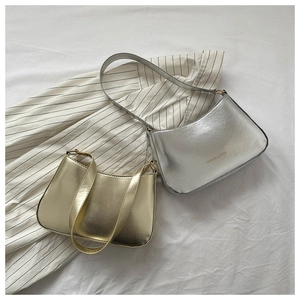 Detail of glossy gold and silver shoulder bags featuring Fashion & Bags logo print
