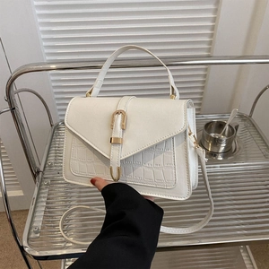 Cream white faux leather handbag with crocodile texture and gold hardware detail