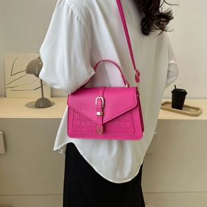 Rose pink crocodile embossed crossbody bag for women with gold clasp and top handle