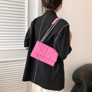 Fashionable bright pink quilted crossbody chain bag with geometric stitching pattern