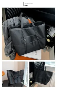 Dettaglio della borsa tote nera in rete con design multitasca e trama traspirante