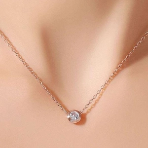 Elegant 18K rose gold titanium necklace featuring a single round cubic zirconia pendant