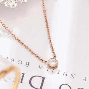 18K rose gold titanium necklace featuring a single round cubic zirconia solitaire pendant